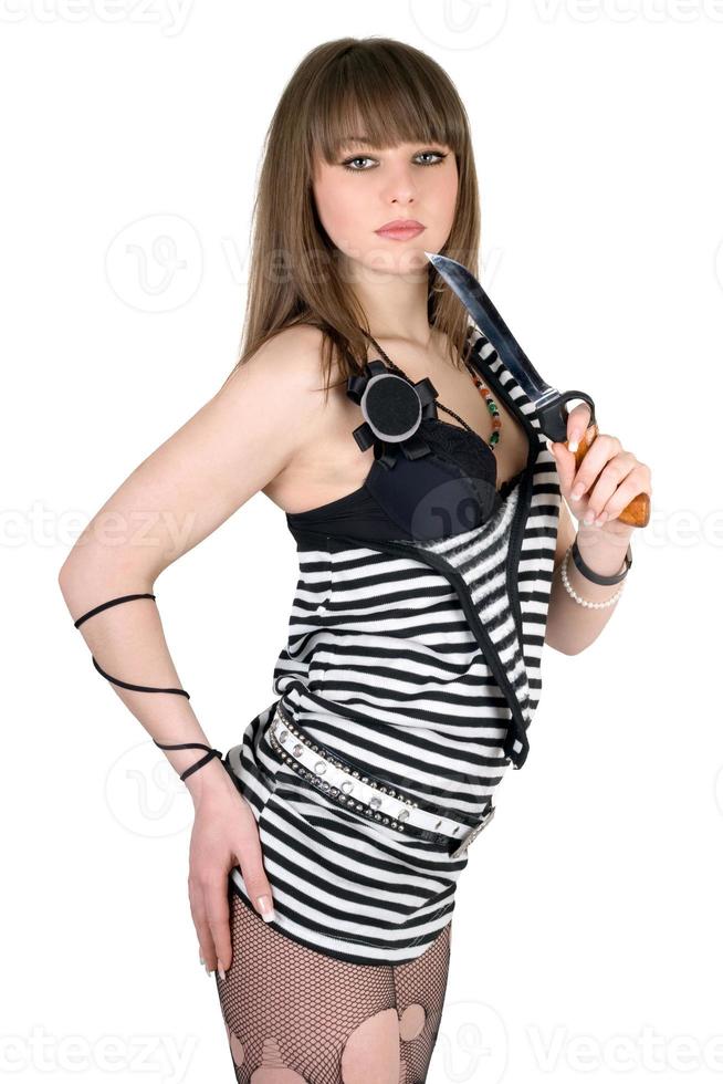 Beautiful girl in a striped dress with a knife photo