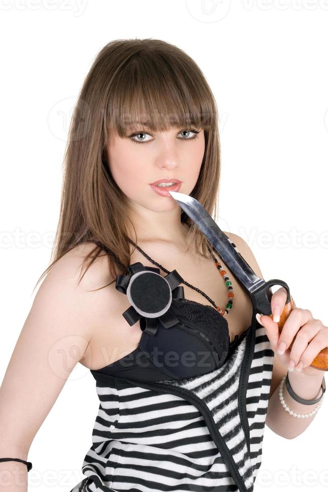 Beautiful girl in a striped dress with a knife photo