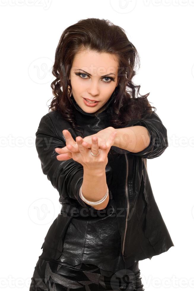 Portrait of playful young brunette in black clothes photo