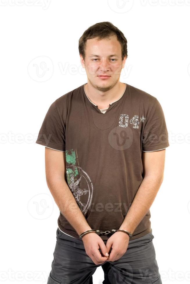 The guy chained in handcuffs. Isolated photo