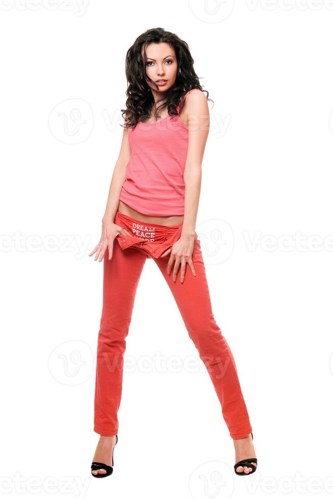 Attractive young brunette in a red jeans photo
