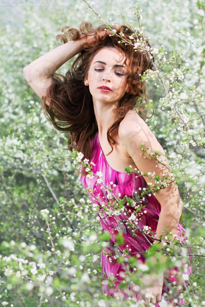 Brunette playing with her hair photo