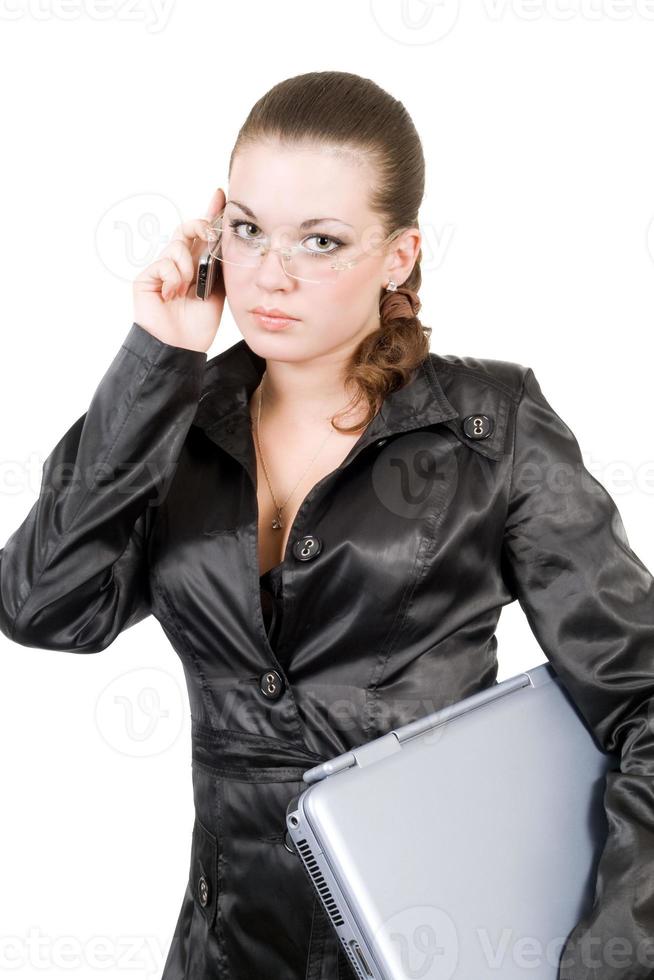 Businesswoman with laptop and phone over white photo