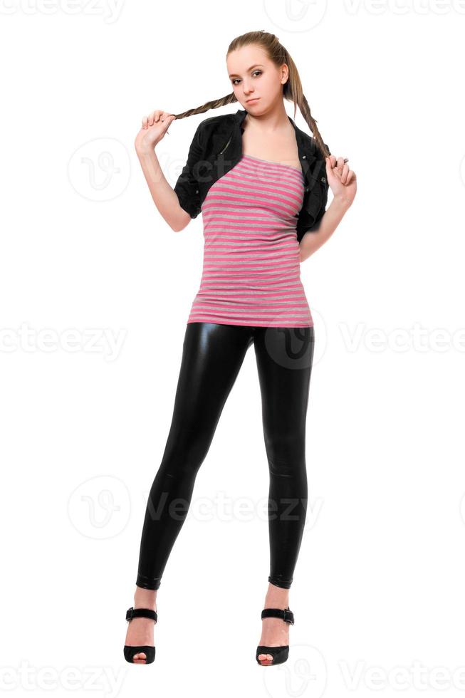 Playful pretty young woman in black leggings photo