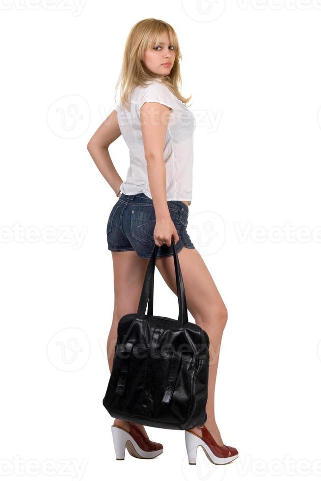 Sexy girl with a black handbag. Isolated photo