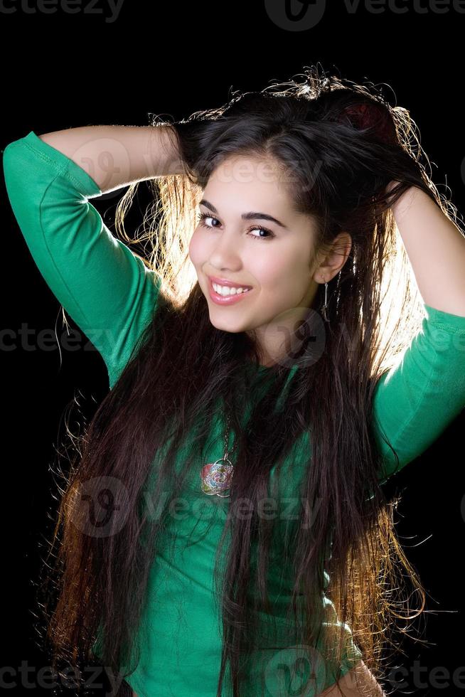 Portrait of the smiling girl. Isolated on black photo