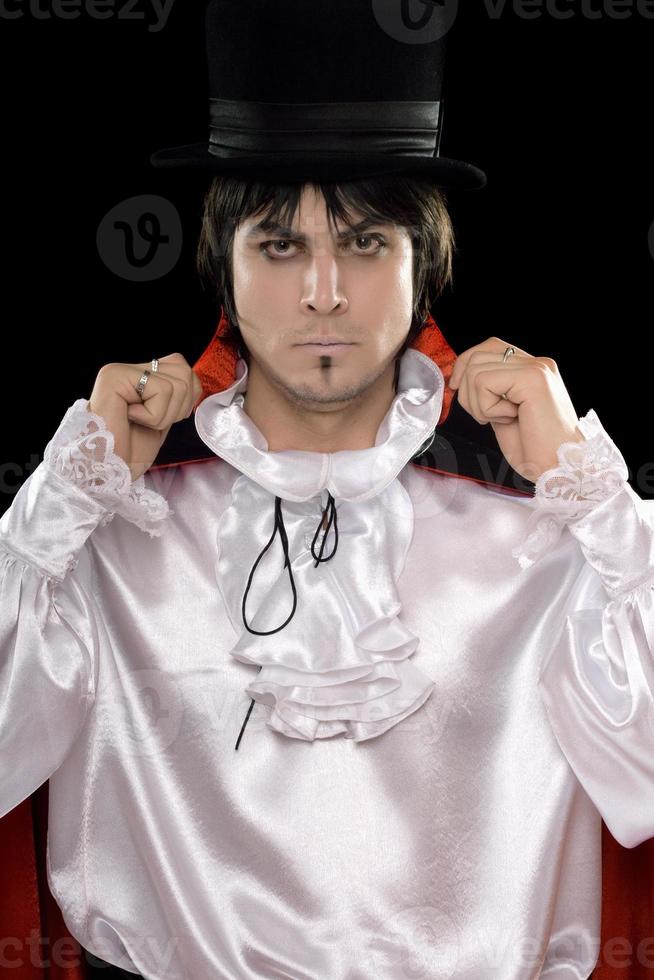 Young man in a suit of Count Dracula photo