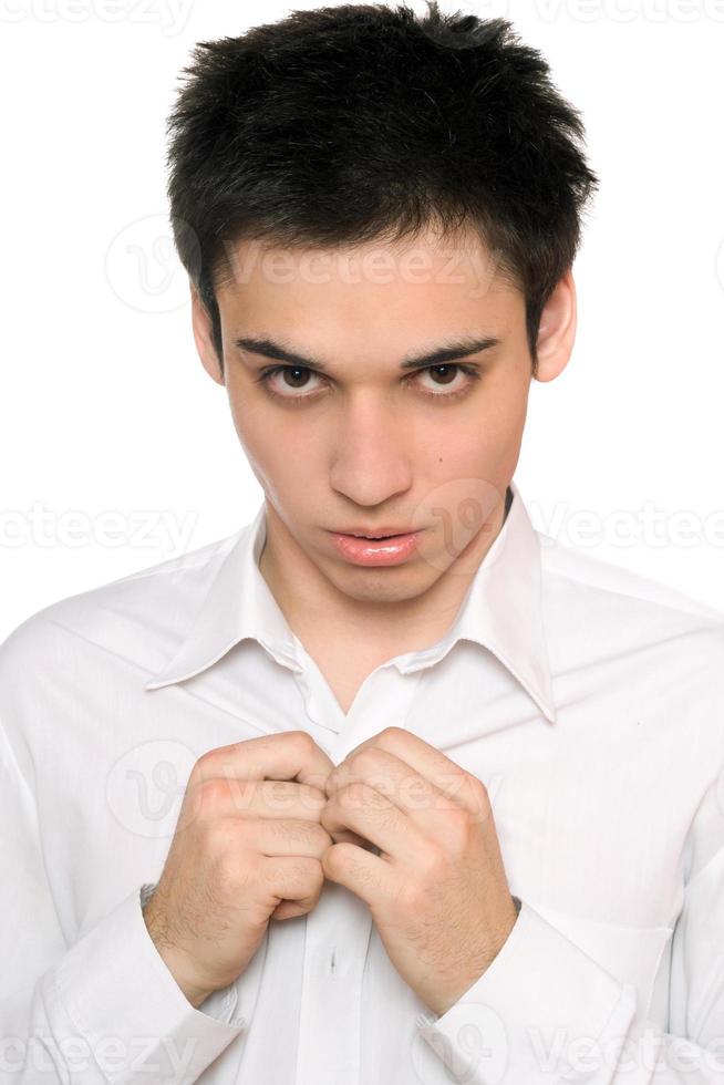 Portrait of handsome young man in a white shirt photo