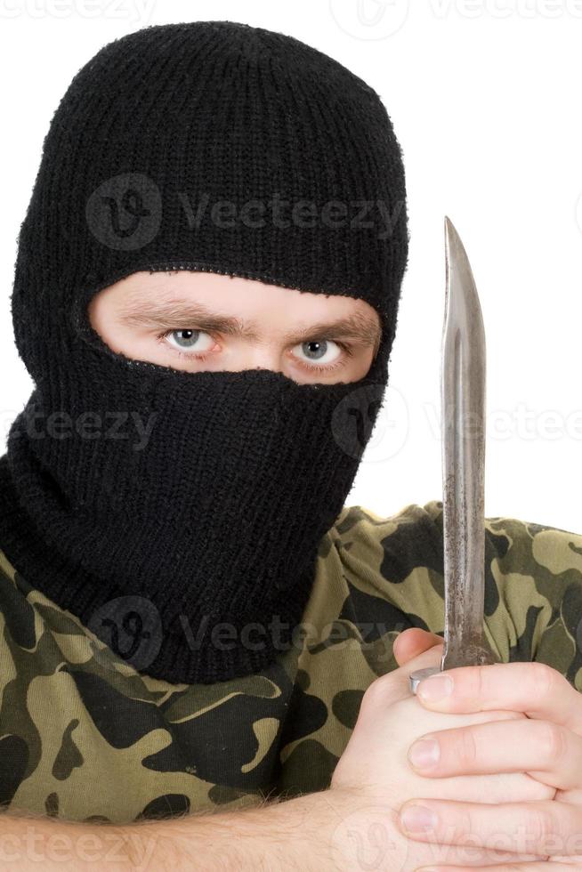 Portrait of the criminal with a knife over white photo