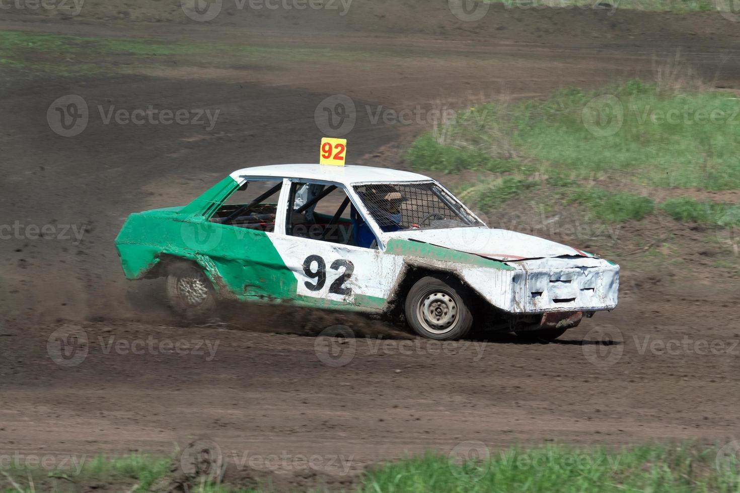 Race for survival. Green white car photo