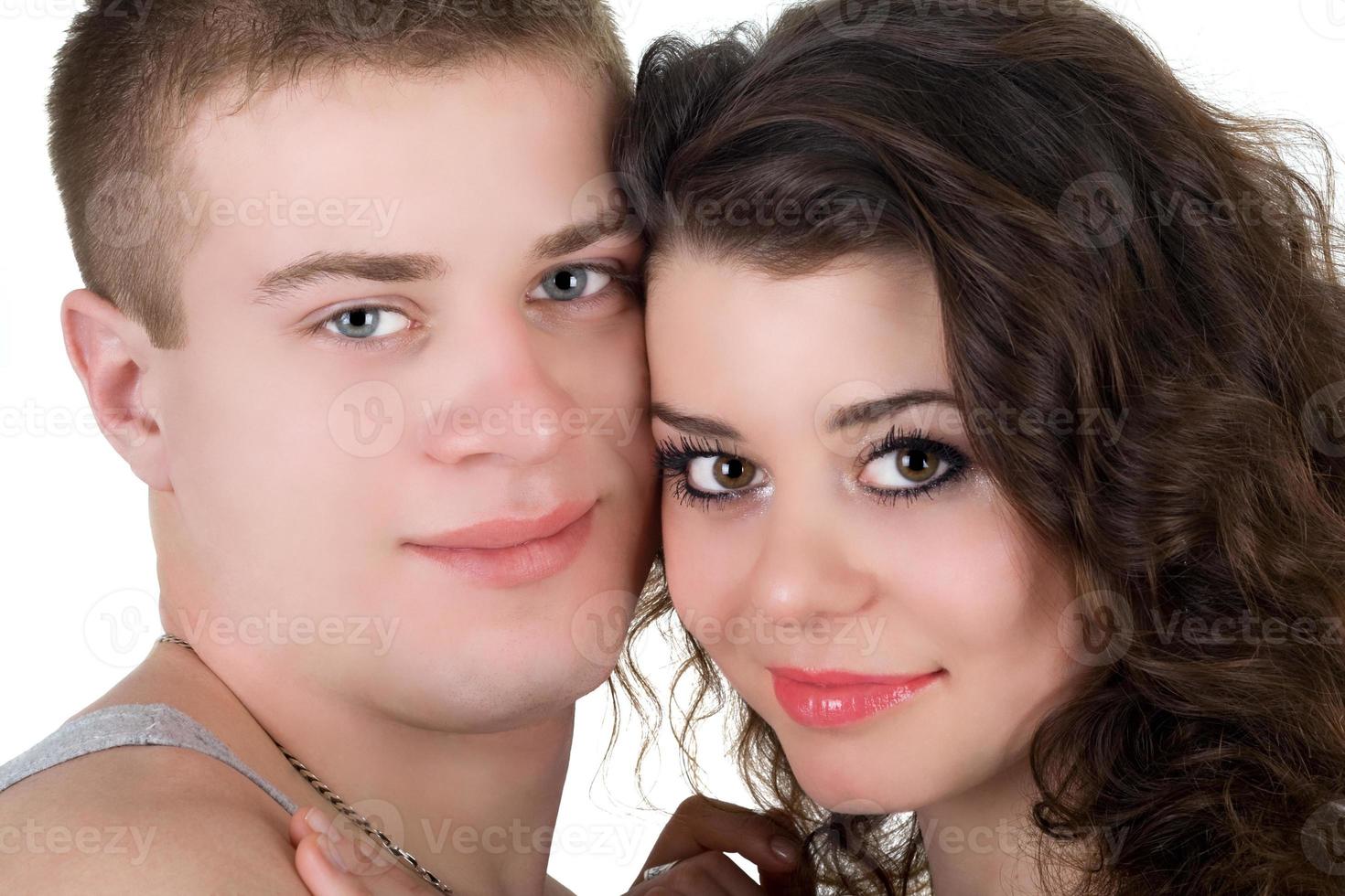 Portrait of the young beautiful couple. Isolated on white photo