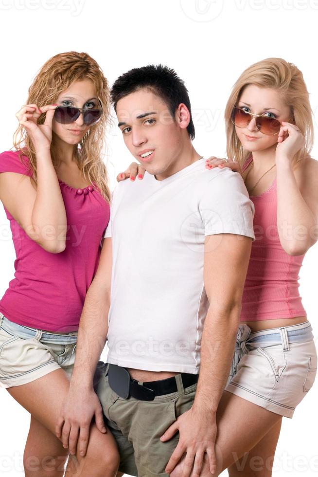 two pretty blonde women with handsome young man photo
