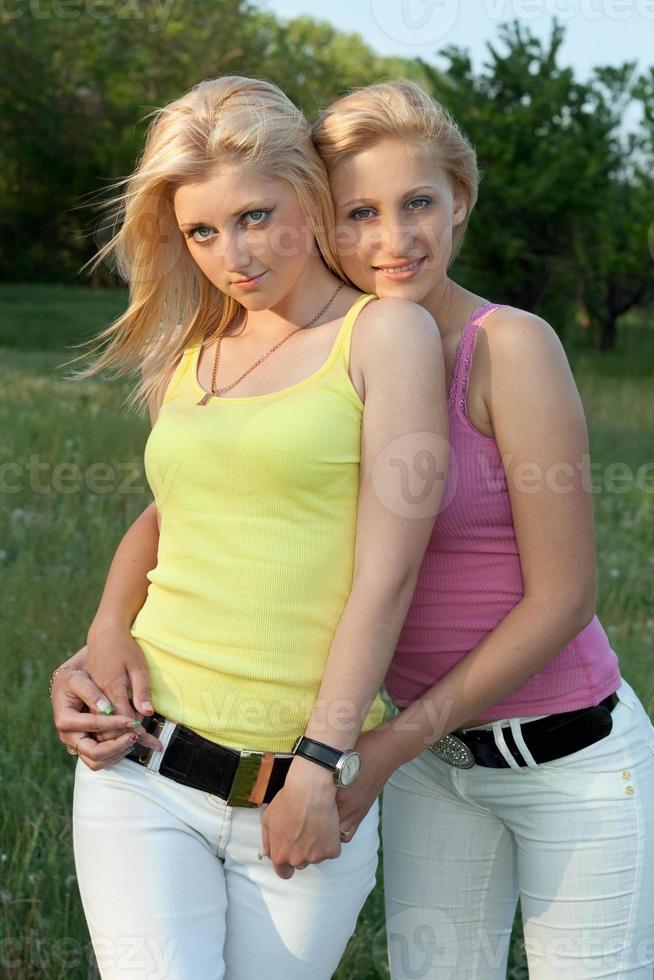 Portrait of two smiling attractive blonde photo