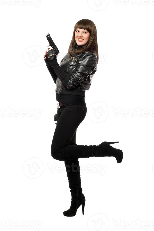 Smiling armed girl in boots photo