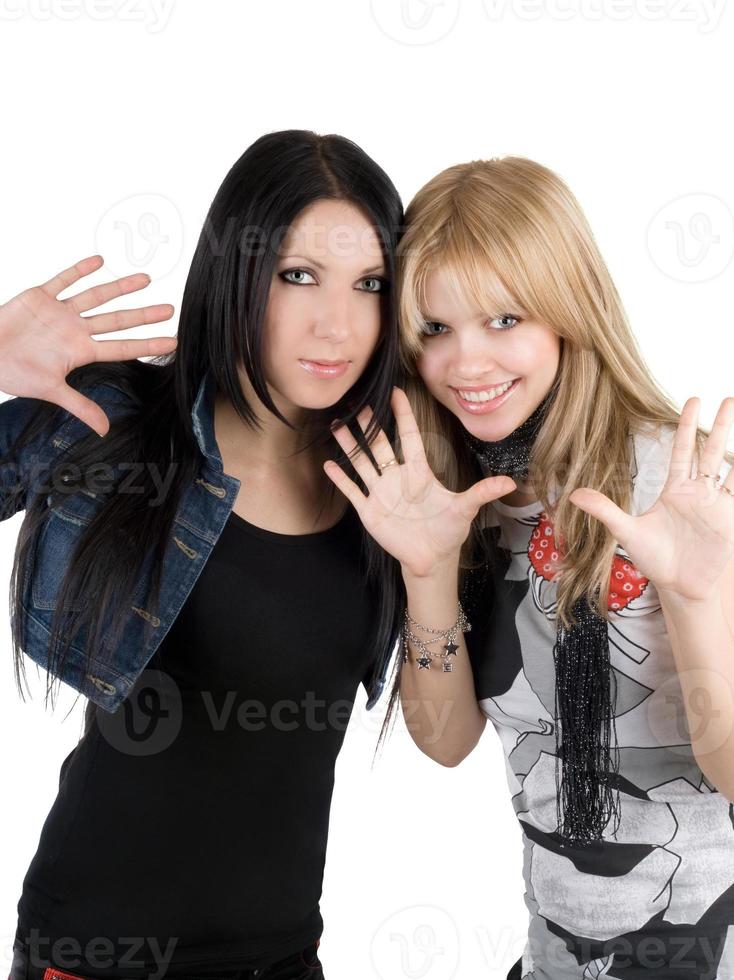 Young blonde and the brunette. Isolated on white photo