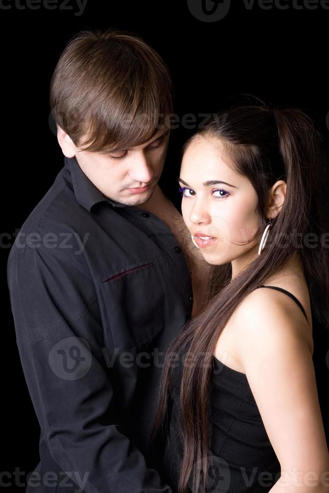 Portrait of the young pair. Isolated on black photo