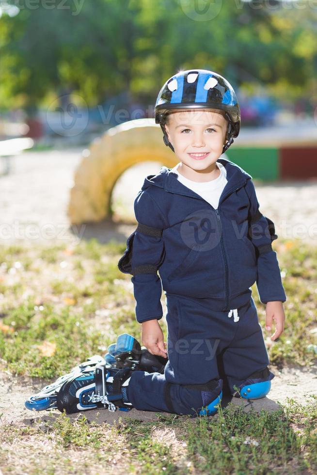 Smiling little skater boy photo