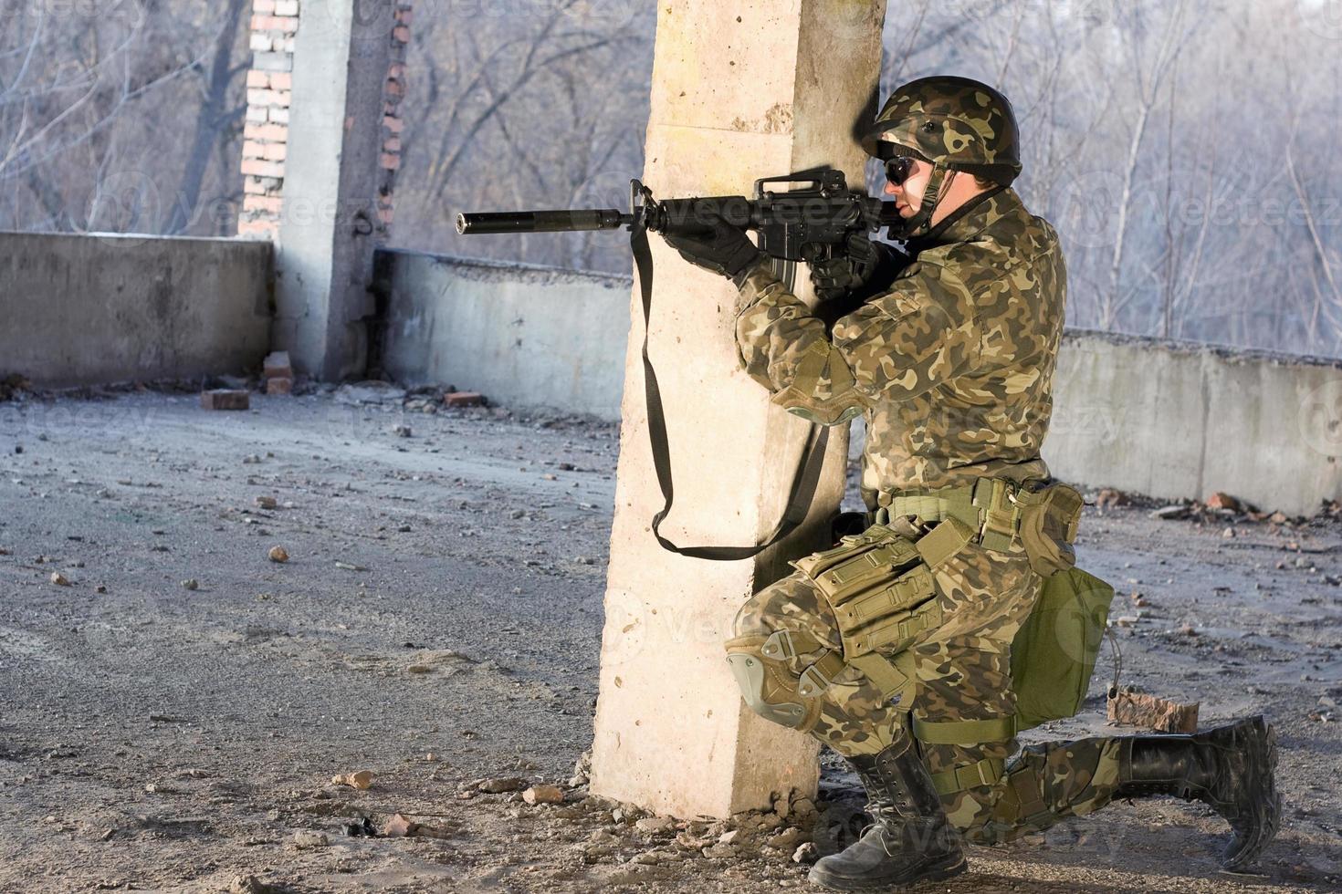 Armed man aiming photo