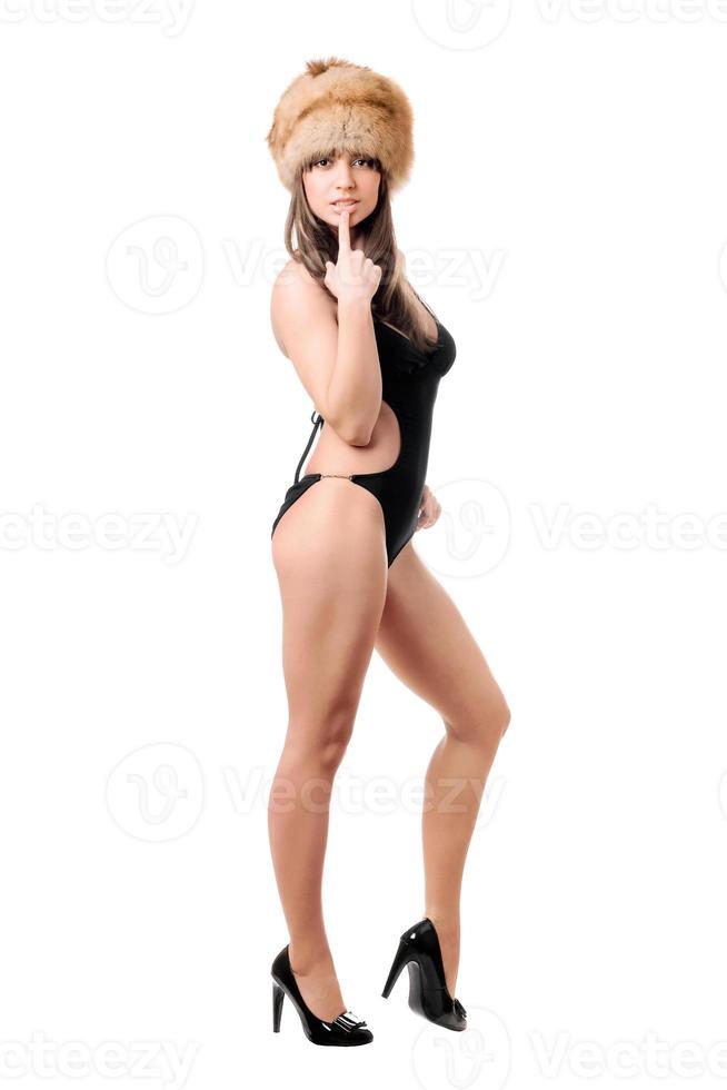 Attractive woman wearing swimsuit and fur-cap photo