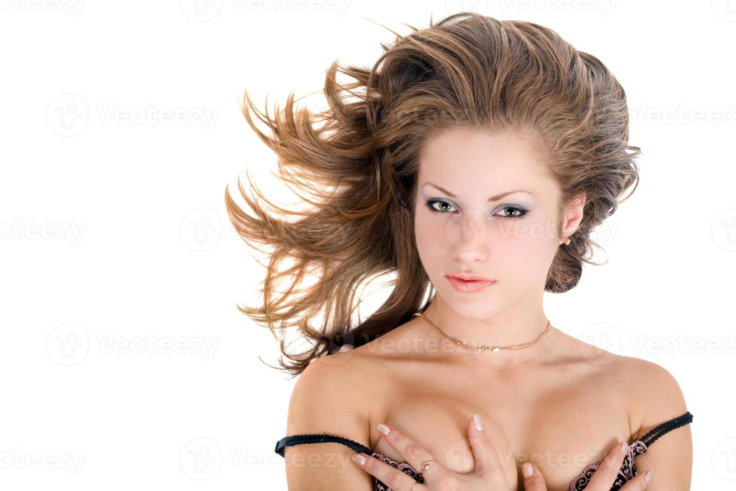 Portrait of the young beautiful woman over white photo