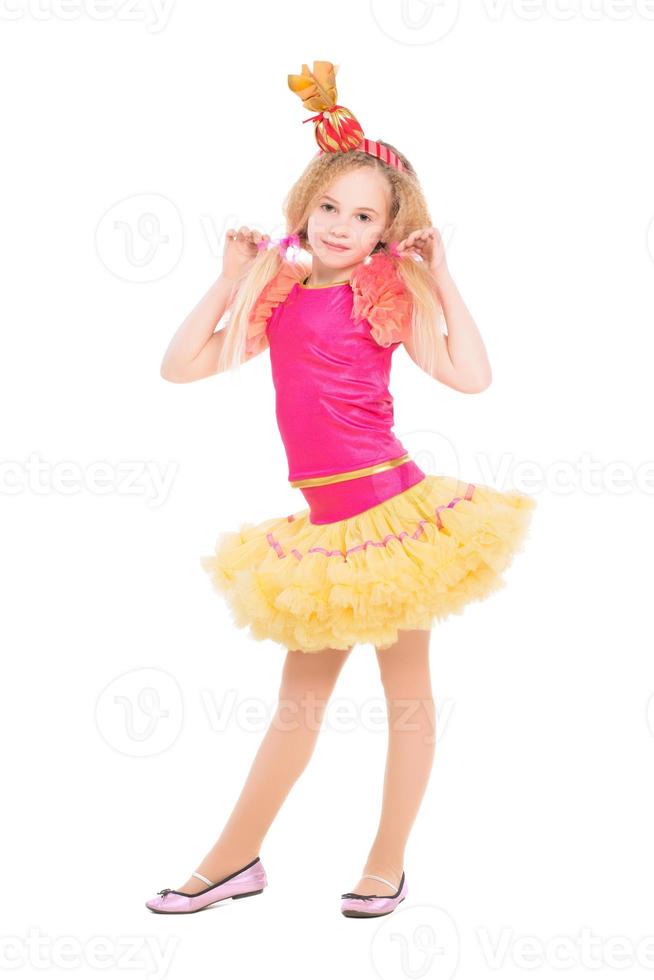 Beautiful little girl posing in candy suit photo