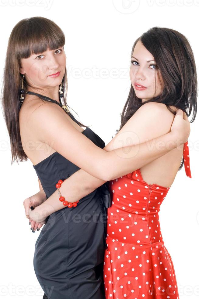 Two embracing beauty young women. Isolated on a white background photo