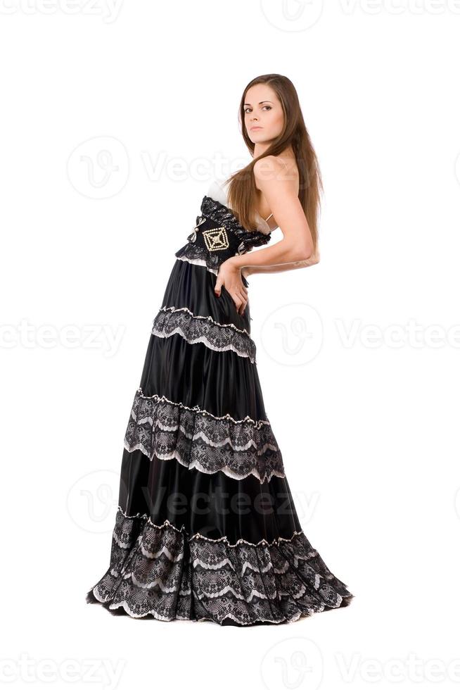 Attractive young woman in long dress photo