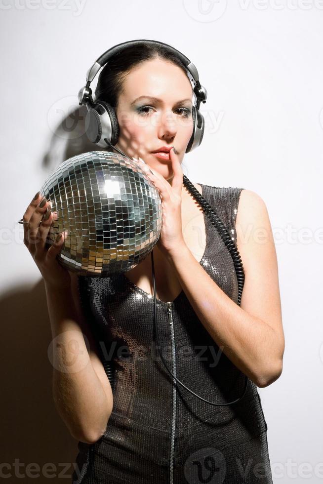 Portrait of nice brunette with a mirror ball photo