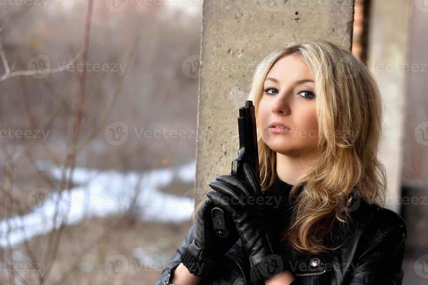 Stunning girl with a weapon photo