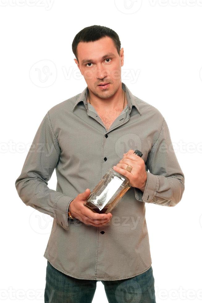 Man with a bottle of whiskey. Isolated photo