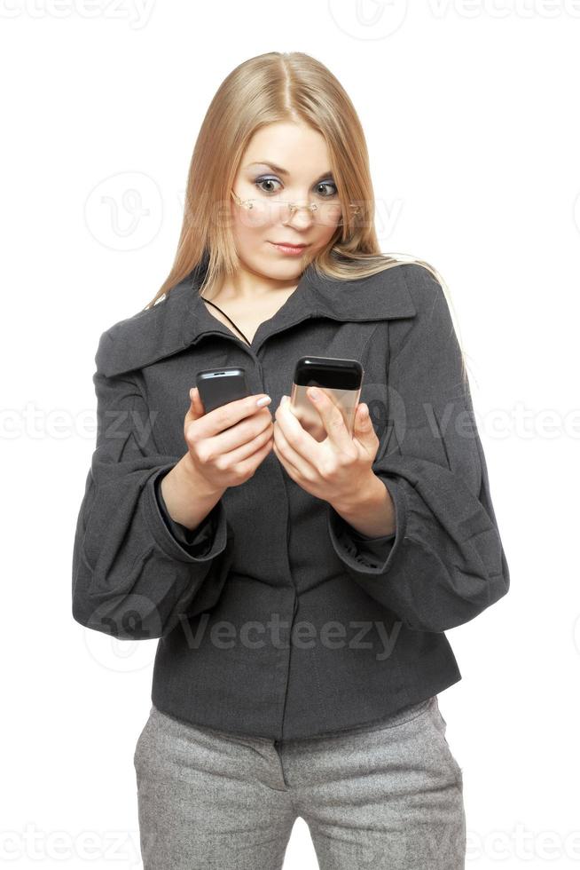 Portrait of surprised young blonde in a gray business suit photo