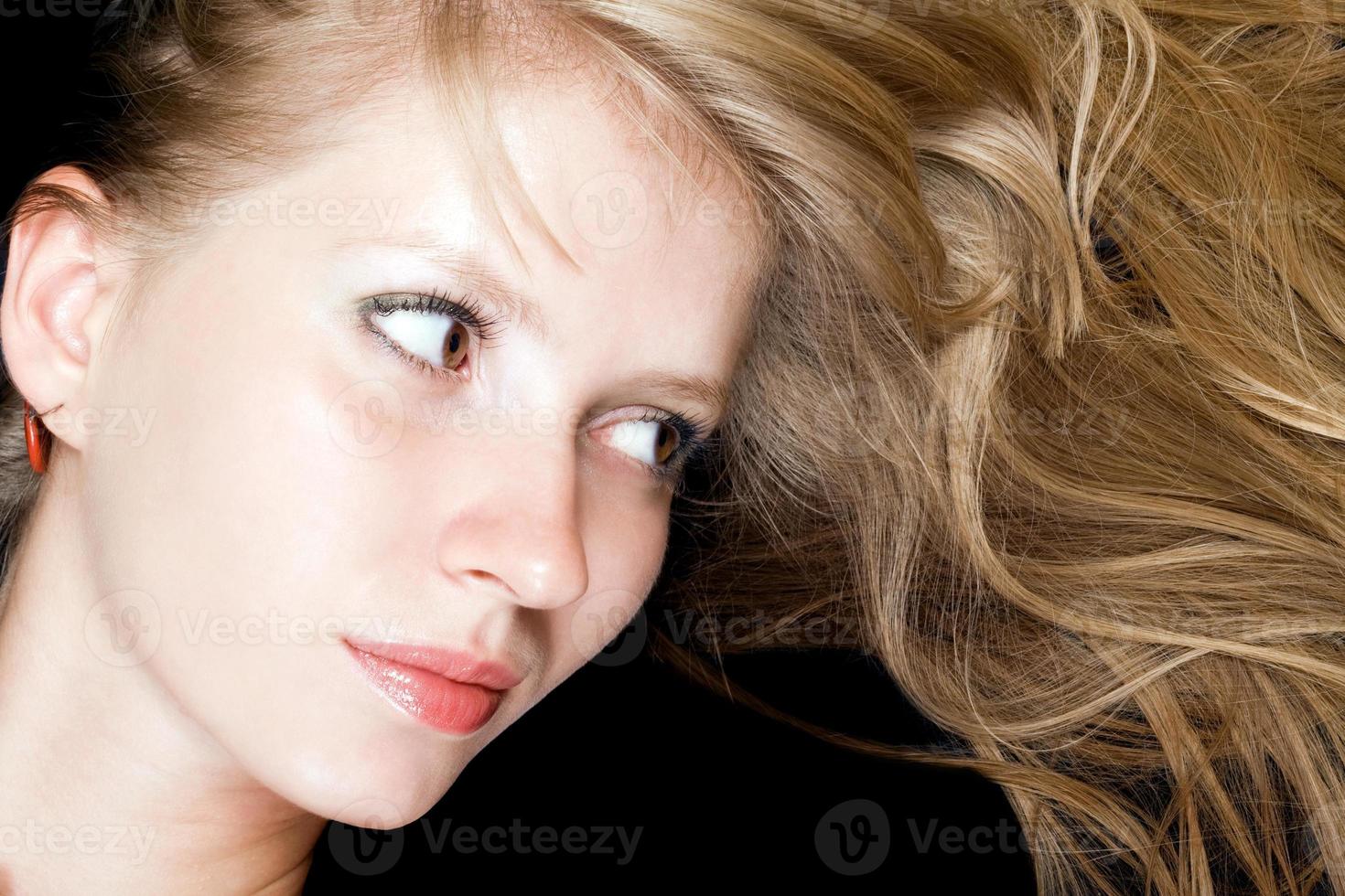 Portrait of the young beauty woman. Isolated on black background photo