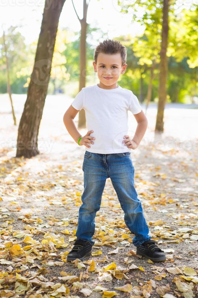 cheerful boy among the trees photo