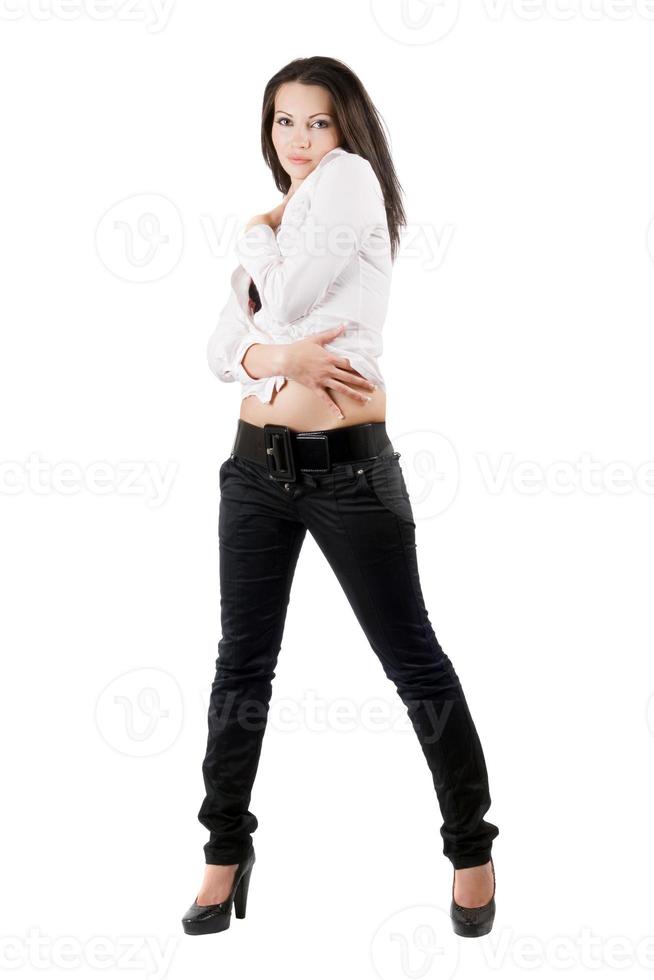 The young woman in black jeans and a white shirt photo