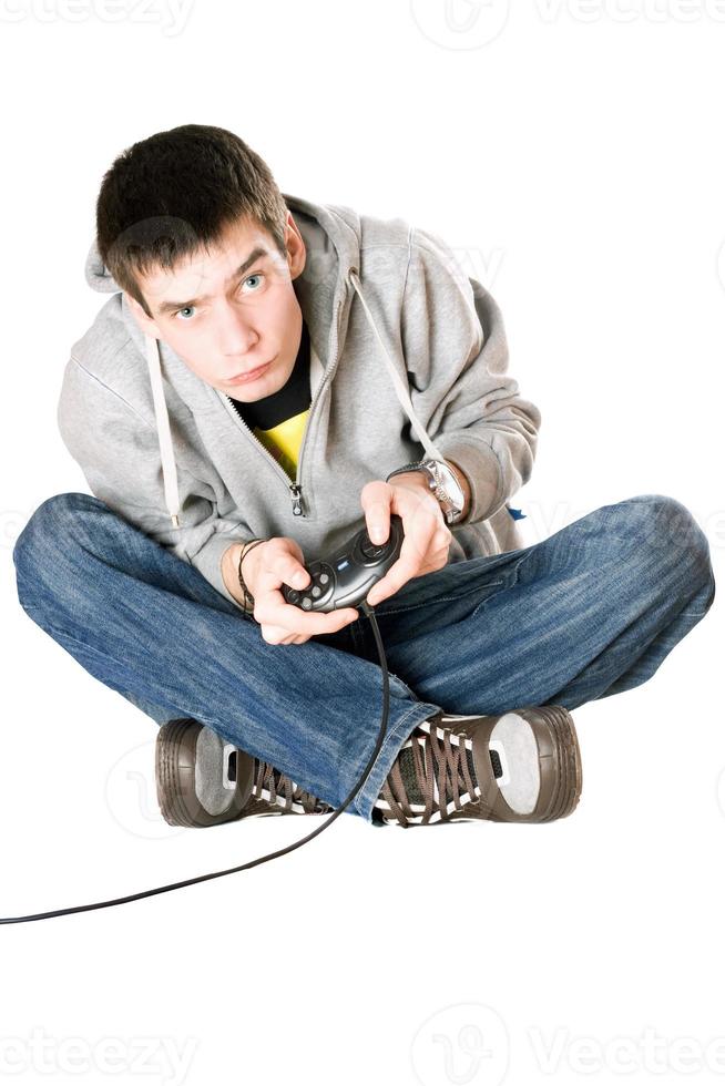 Young man with a joystick photo