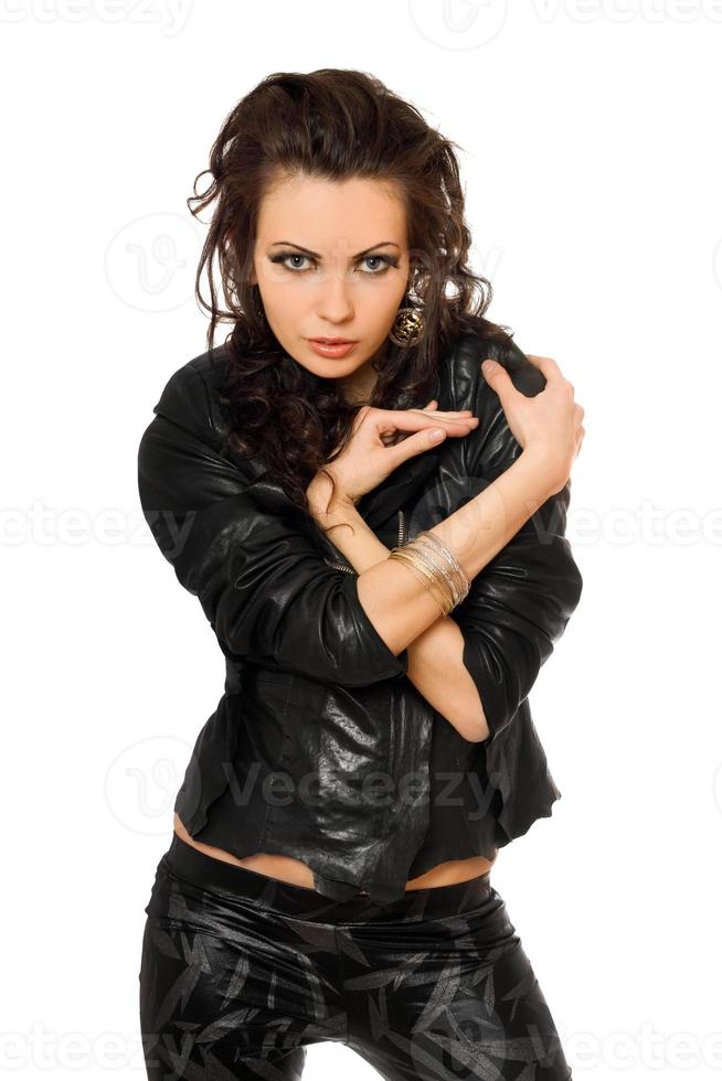 Portrait of sexy young brunette in black clothes. Isolated photo