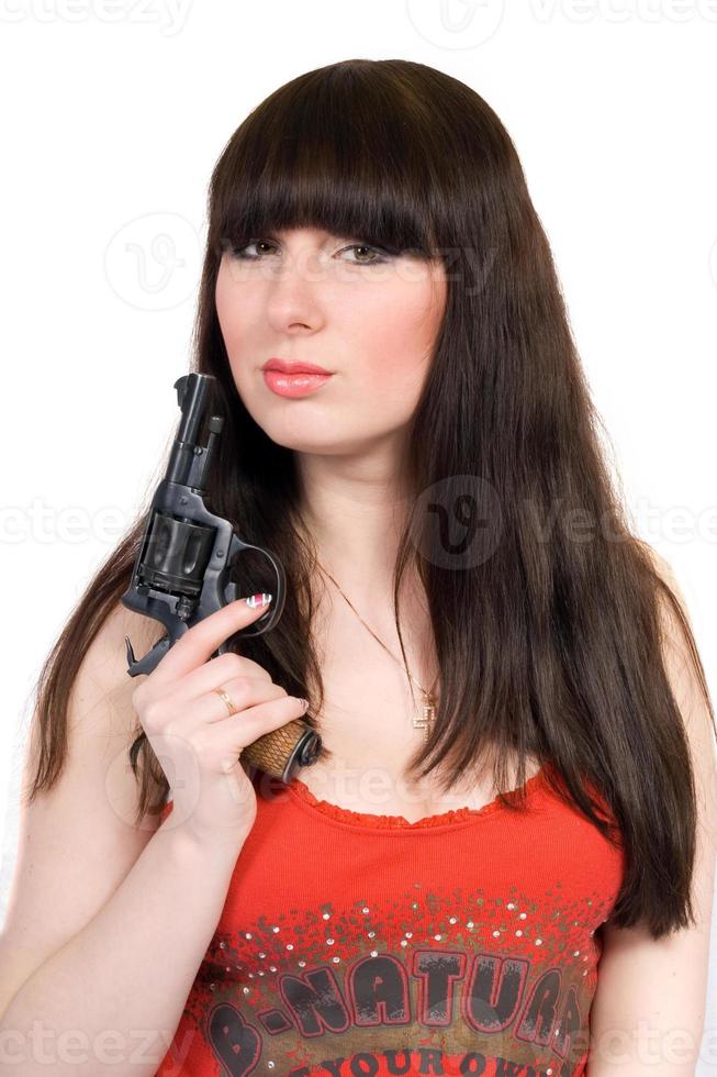 The young woman with a pistol. Isolated photo