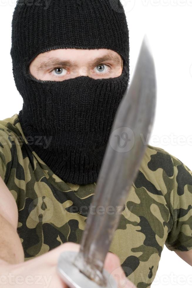 Portrait of the killer with a knife over white photo