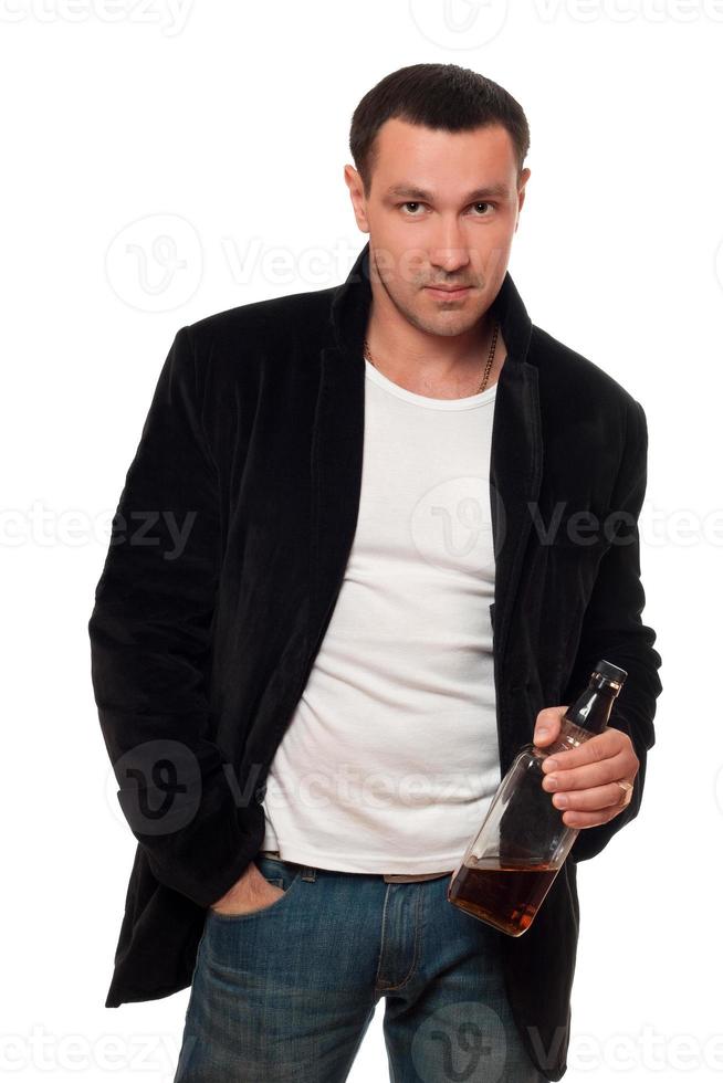 Man with a bottle of scotch. Isolated photo