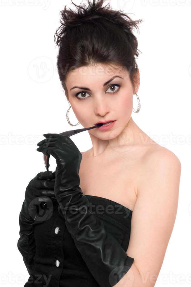 Portrait of attractive young brunette in a black dress photo