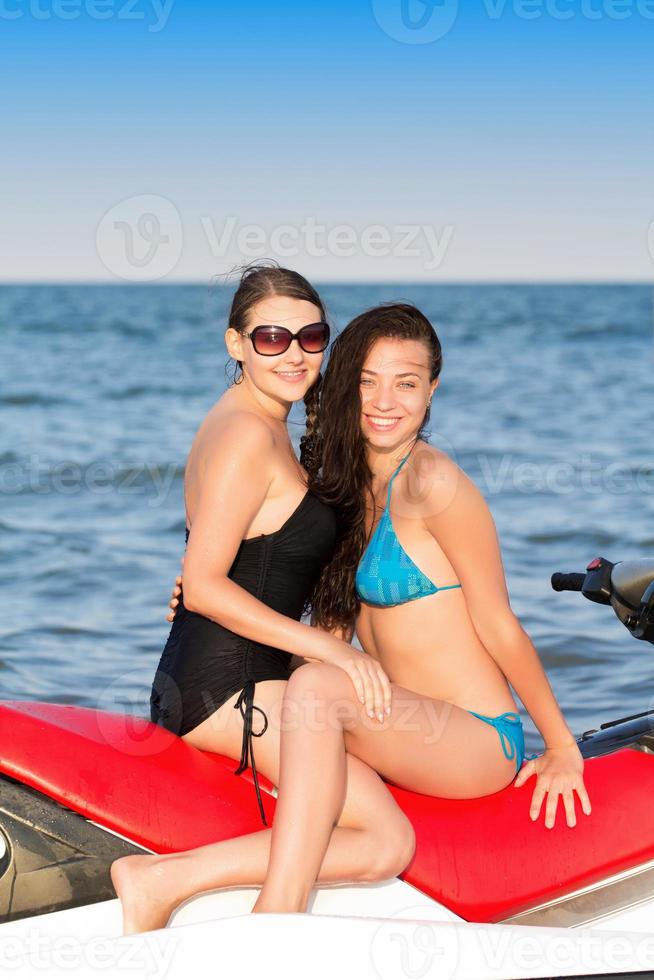 Two young smiling women photo