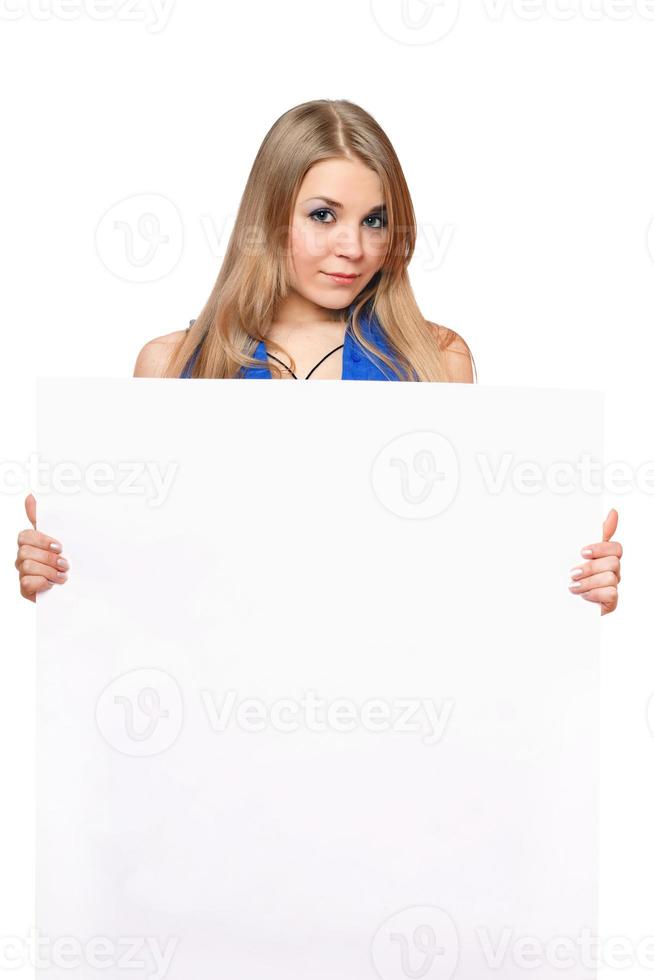 Pretty young woman posing with white board photo