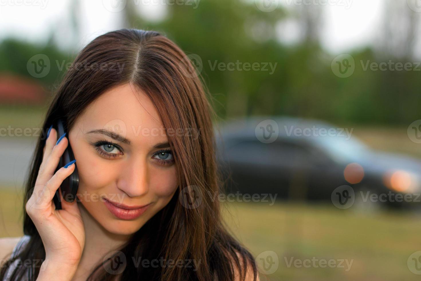 young woman calling by phone photo