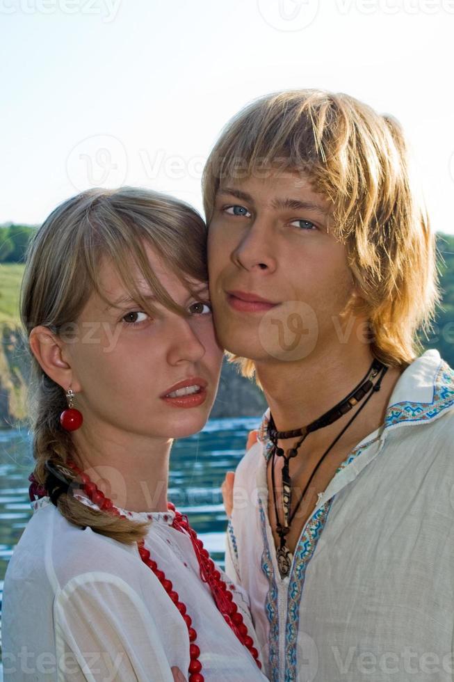 Portrait of the young beautiful couple outdoors photo