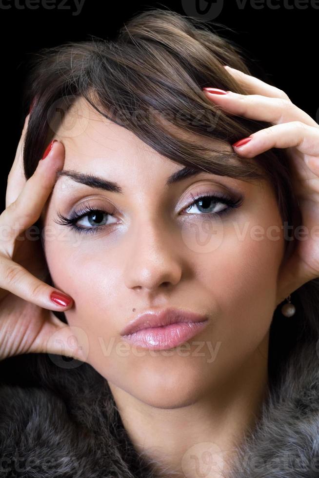 Beautiful brunette posing closeup photo