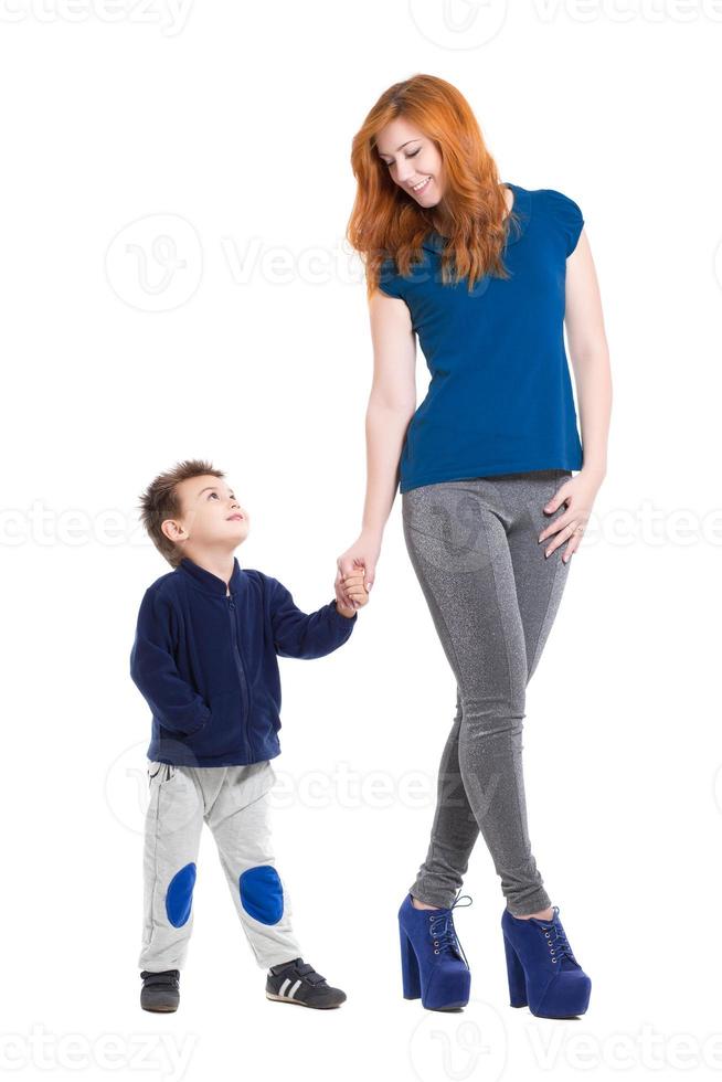 Pretty smiling woman posing with a little boy photo