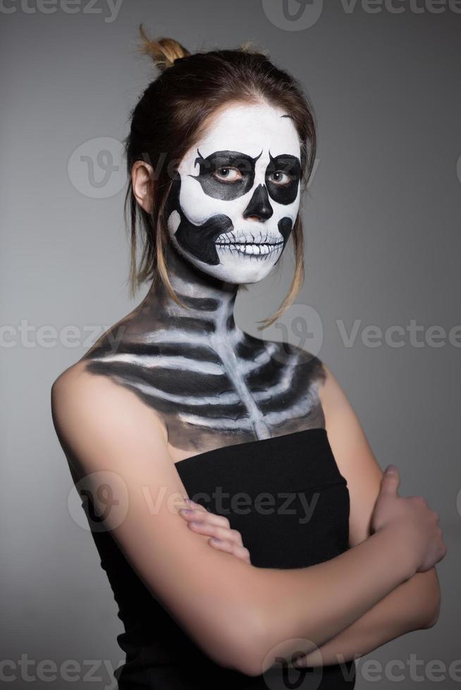 Portrait of brunette with painted face photo