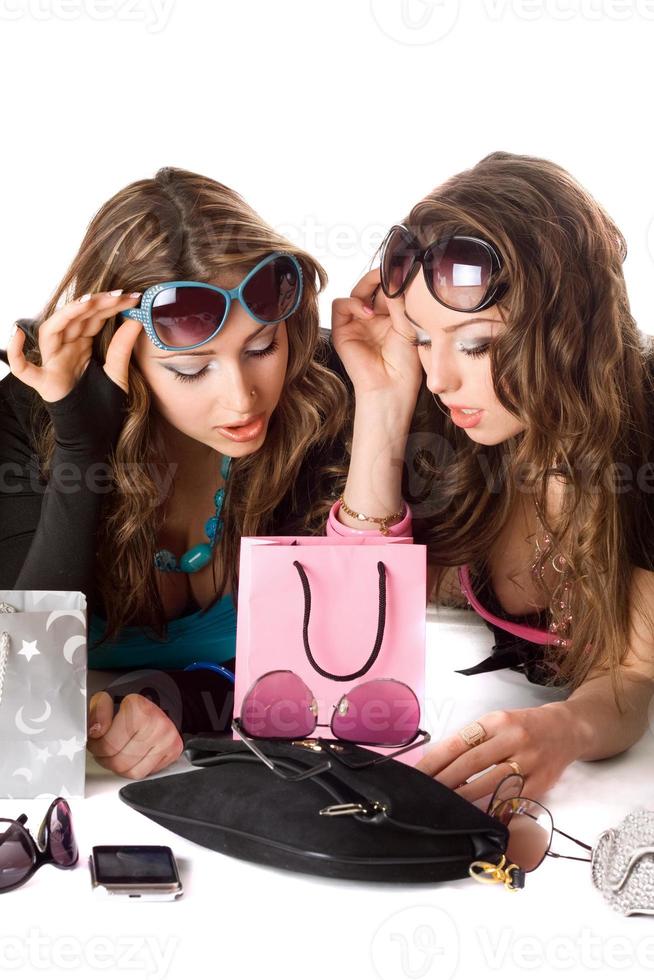 Two pretty girlfriends in sunglasses photo