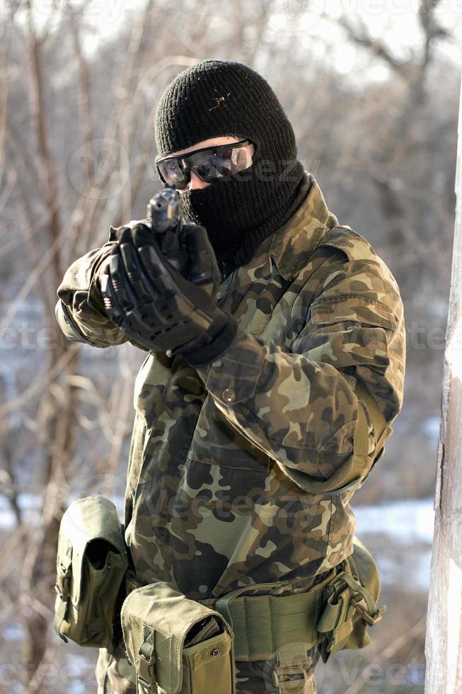 Portrait of soldier with a handgun photo