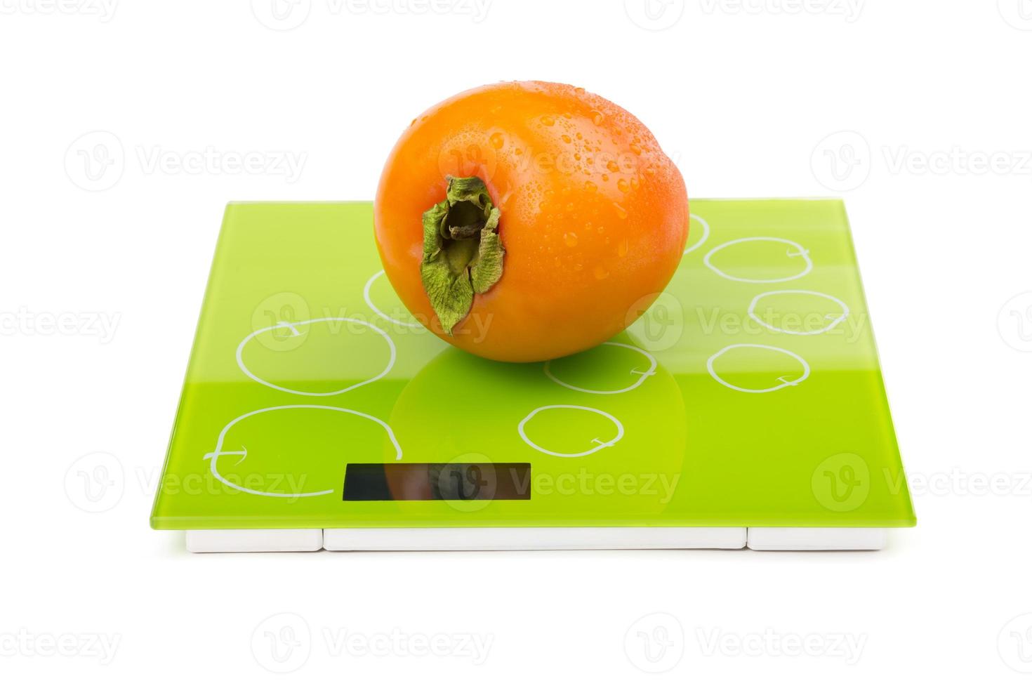 Persimmon on square scales photo